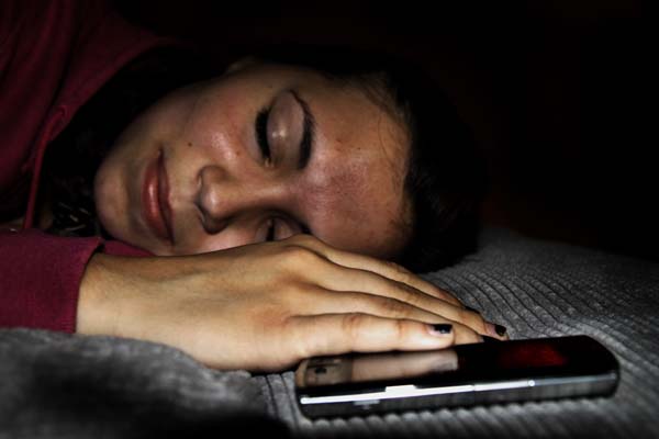 Students often choose phones over sleep