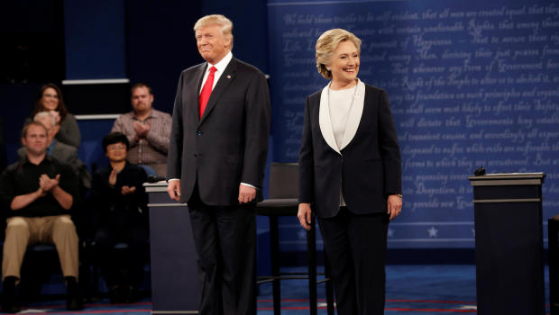 Republican U.S. presidential nominee Donald Trump and Democratic U.S. presidential nominee Hillary Clinton appear together during their presidential town hall debate at Washington University in St. Louis, Missouri, U.S., October 9, 2016.   REUTERS/Mike Segar - RTSRIKQ