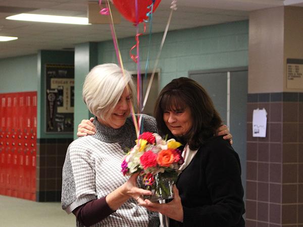 Billie Ann Dio (right) is presented her award by last years winner.