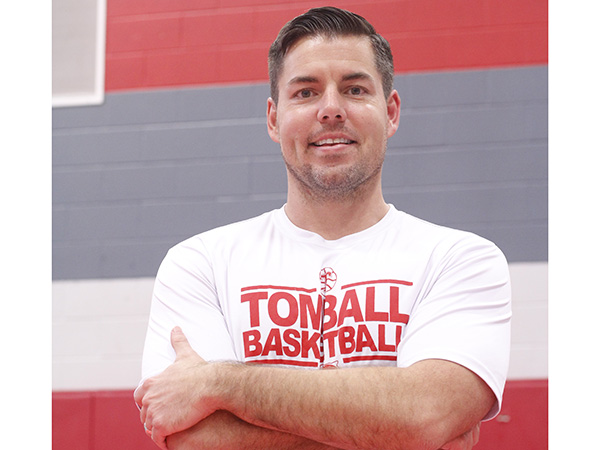 New boys basketball coach takes over with large expectations.