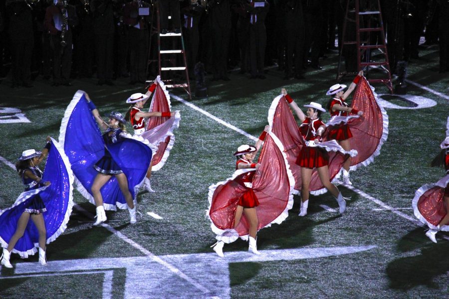 Heres a pic of the Cougar Charms and TMHSs drill team doing a jaw dropping performance. 