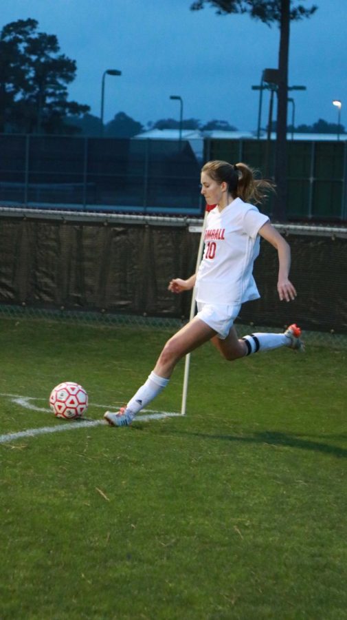 Elaine Griffin launches  a corner kick for the girls varsity team.