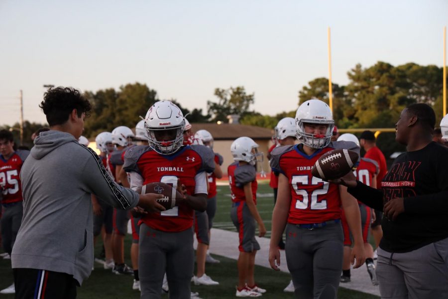 Coaches work with the players to make sure their ready for the district opener on Friday.