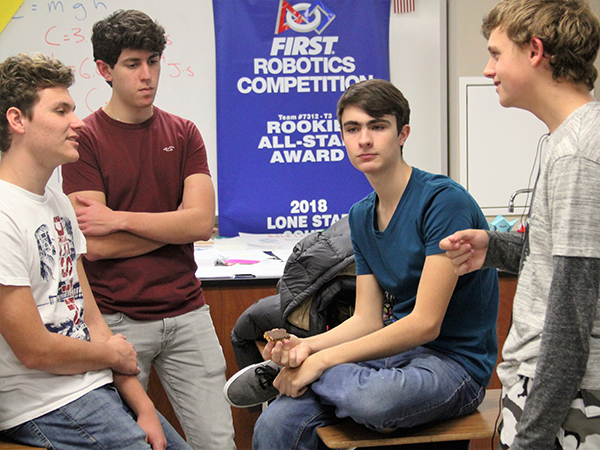 Members of the Robotics Team plan for their upcoming contest.