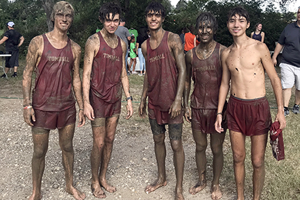 Cross country team finishes mud run.