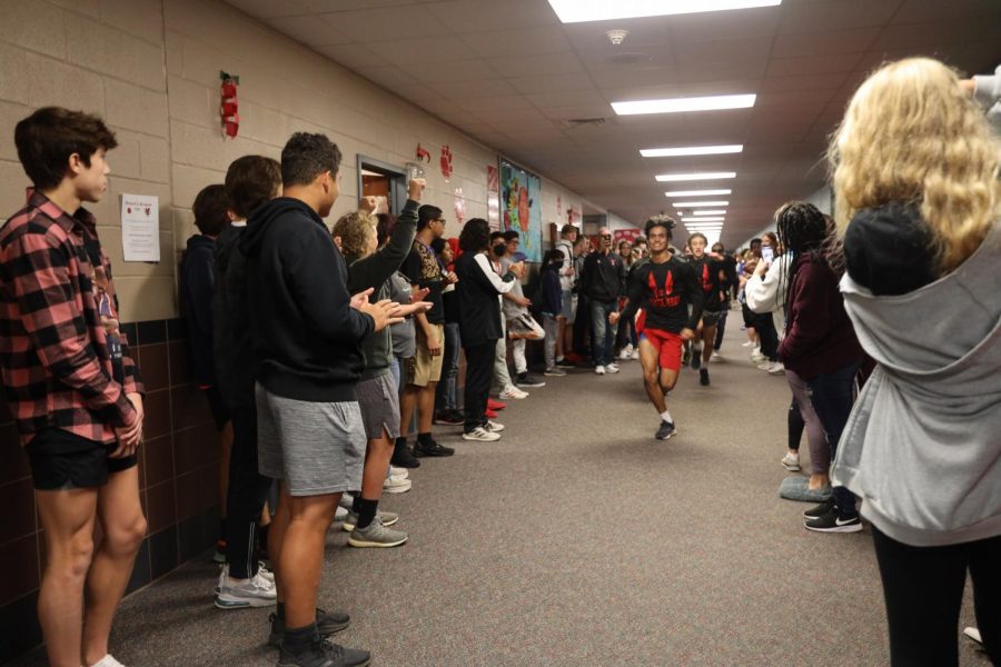 The student body turns out to cheer on the cross country team Friday as they head to state.
