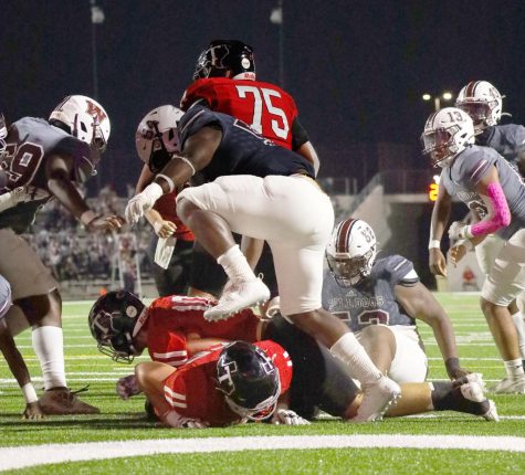 A Cougar player has his head stepped on during a game against Waller. Luckily the helmet protected him.