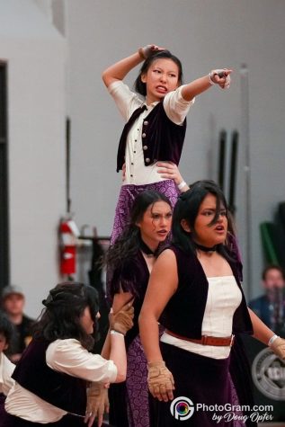 Varsity Color guard performing their show Runaway Train