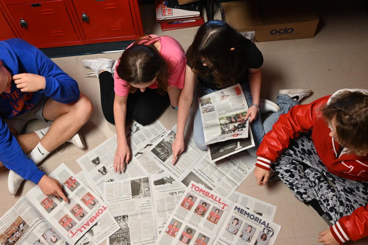 Newspaper staff looks vigorously through print edition