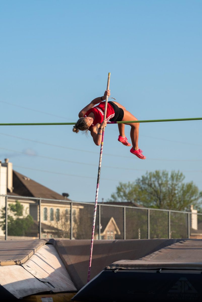 Kinley clears the bar at the Tomball Memorial meet this past Friday.