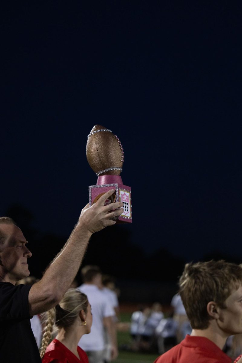 The Powder Puff trophy being raised after red teams victory