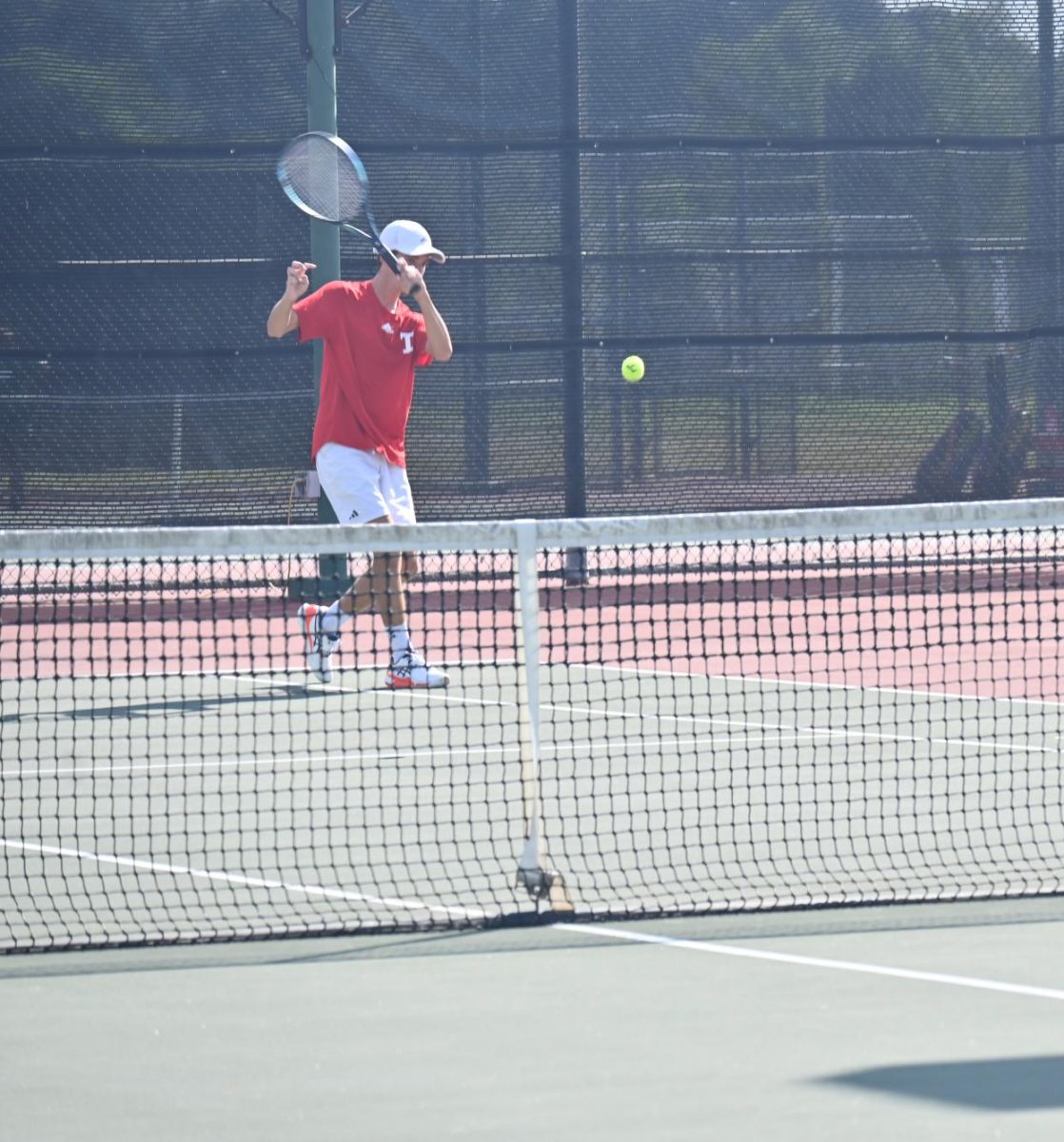 Tomball Tennis player getting ready to slice the ball.