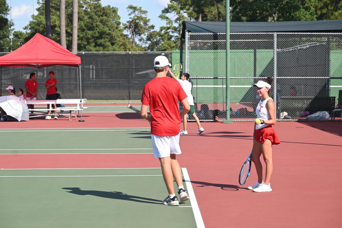 Tomball mixed doubles planning out a strategy.