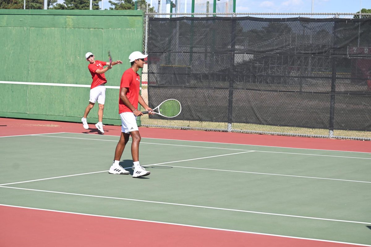 Tomball boy's doubles hitting the ball back to Klein.