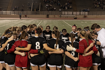 The girls soccer team pauses after the game against Magnolia, their first district loss.