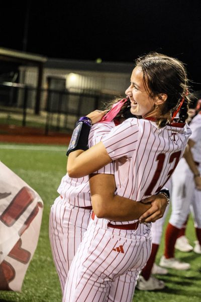 Regina Amaya embracing Aubrey Murillo after the game