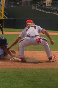 The Cougars tag out the runner trying to steal second.