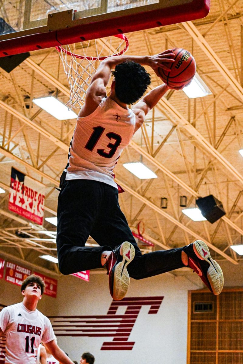 Cougar coming up for lay up